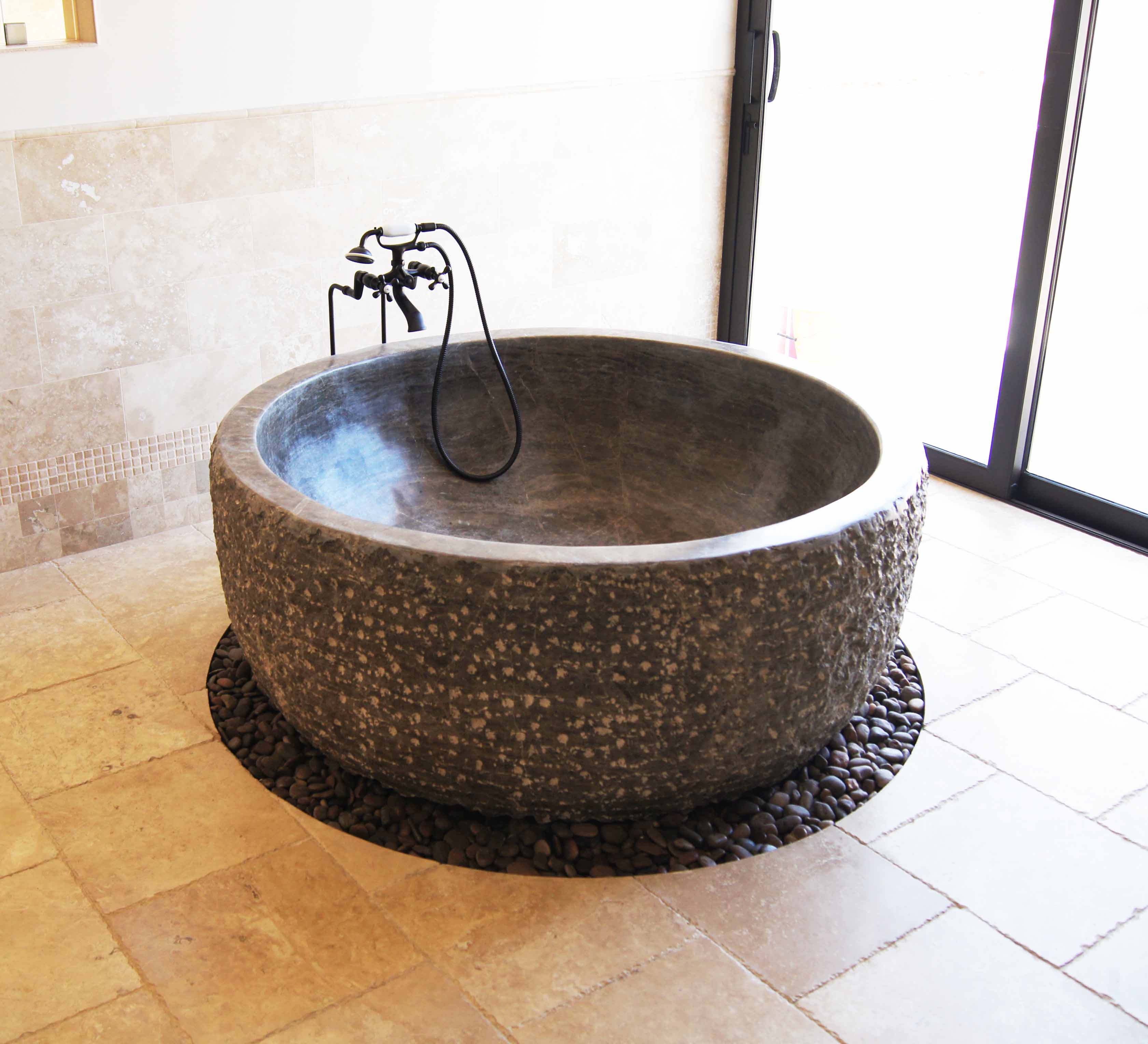 Chiseled outside with polished inside round stone tub Chiseled outside with polished inside round stone tub